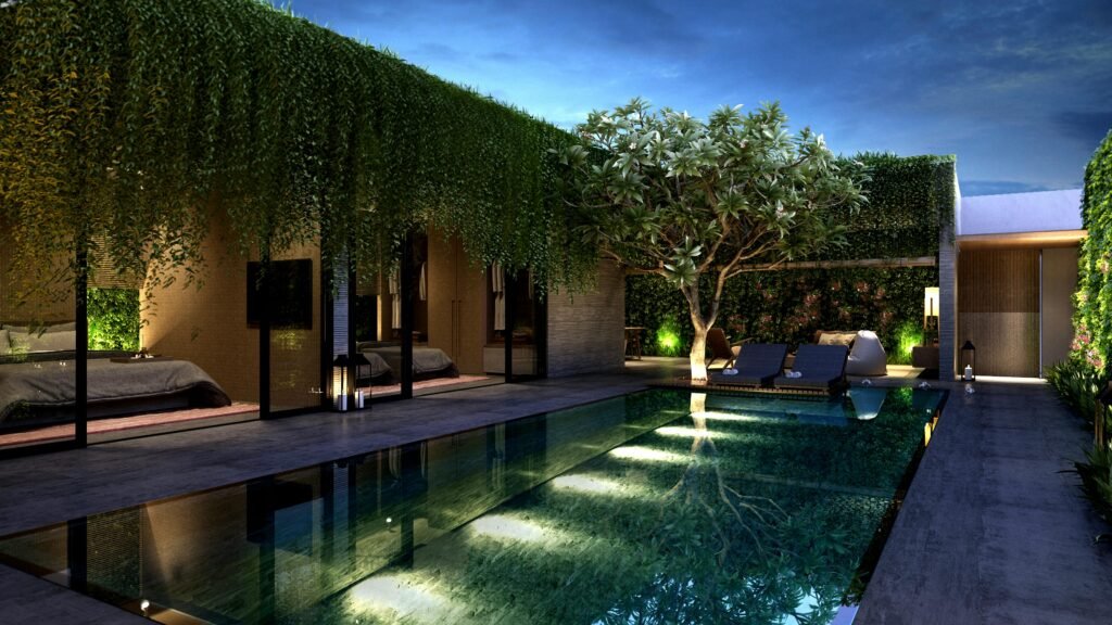 outdoor patio at night with a vertical green wall, draping vines and beautiful outdoor lighting